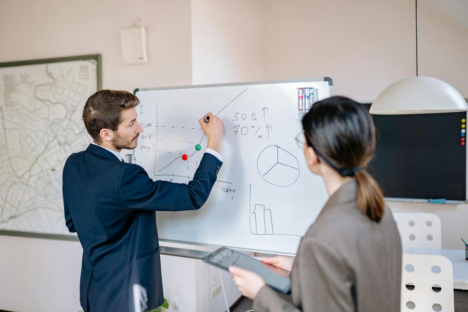 Whiteboard with product strategy sketches